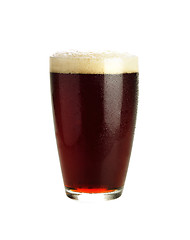 Image showing Glass of dark beer isolated on white