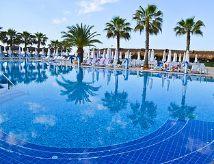 Image showing Water pool and chairs - vacation background