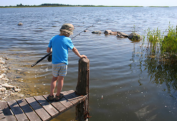 Image showing Young boy fishing