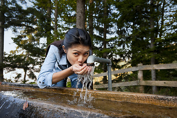 Image showing pretty woman drinking water
