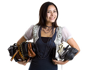 Image showing woman with many a purses