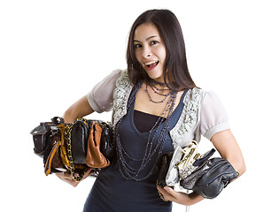 Image showing woman with many a purses