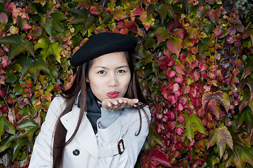 Image showing autumn kiss from beautiful woman