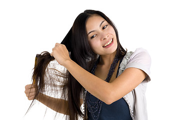 Image showing woman brushing her hair