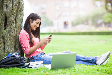 Image showing Hispanic college student texting