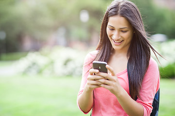 Image showing Hispanic college student texting