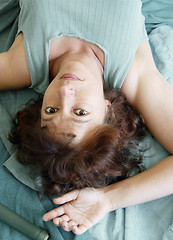 Image showing Beautiful woman lying upside down