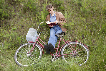 Image showing Man reads book