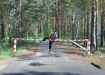 Image showing  Man overcomes forbidding barrier