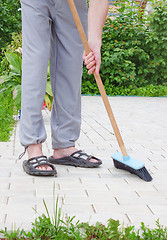 Image showing Men in sandals and  brush