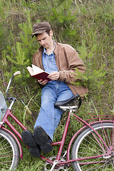 Image showing Man reads book