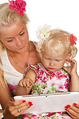 Image showing mother and daughter looking tablet, isolated on white