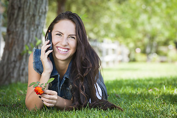 Image showing Mixed Race Young Female Talking on Cell Phone Outside