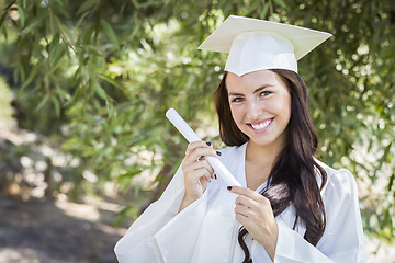 Image showing Graduating Mixed Race Girl In Cap and Gown with Diploma