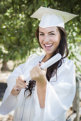 Image showing Graduating Mixed Race Girl In Cap and Gown with Diploma