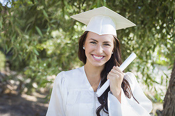 Image showing Graduating Mixed Race Girl In Cap and Gown with Diploma