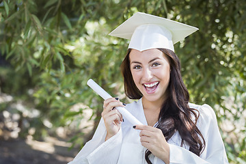 Image showing Graduating Mixed Race Girl In Cap and Gown with Diploma