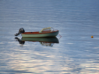 Image showing Motorboat on calm bay water