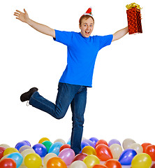 Image showing Dancing happy man with a christmas gift