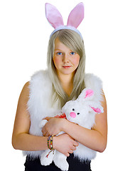 Image showing Young blonde in a fancy-dress with toy rabbit