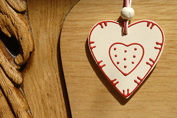 Image showing heart hung on wooden door