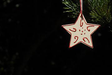 Image showing christmas, star hanging from the fir tree