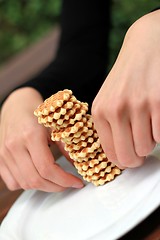 Image showing making a tower of wafer cookies