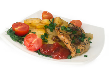 Image showing Chicken breast with roasted potatoes and fresh tomatoes.