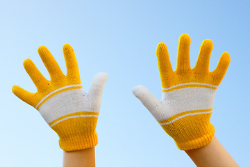 Image showing Two hands dressed in gloves