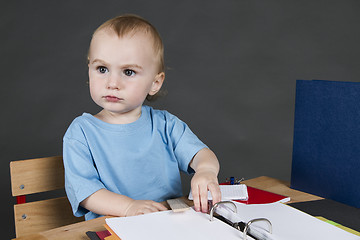 Image showing young child at small desk