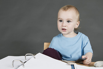 Image showing young child at small desk