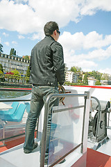 Image showing Boating in Lugano - Man driving a boat on a lake in Lugano, Swit