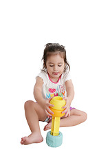 Image showing Funny little kid playing with toys, isolated over white 