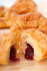 Image showing croissant French brioche filled with berries jam