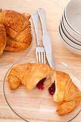 Image showing croissant French brioche filled with berries jam