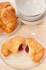 Image showing croissant French brioche filled with berries jam