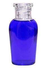 Image showing Small bottle with blue liquid on white background