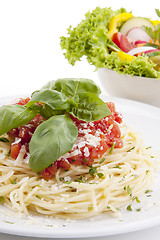 Image showing tatsty fresh spaghetti with tomato sauce and parmesan isolated