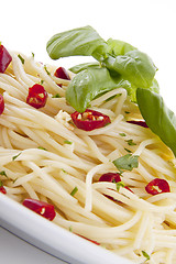 Image showing fresh pasta with chilli and basil isolated