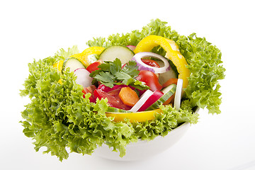 Image showing fresh tasty mixed salad with different vegetables isolated