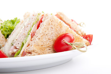 Image showing fresh tasty club sandwich with salad and toast isolated