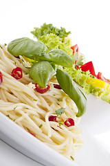 Image showing fresh pasta with chilli and basil isolated