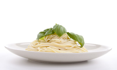 Image showing fresh delicious pasta with basil isolated on white