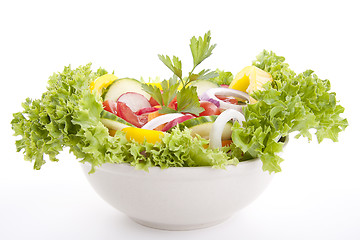 Image showing fresh tasty mixed salad with different vegetables isolated