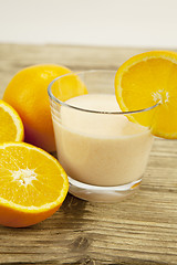 Image showing fresh tropical orange yoghurt shake dessert on table