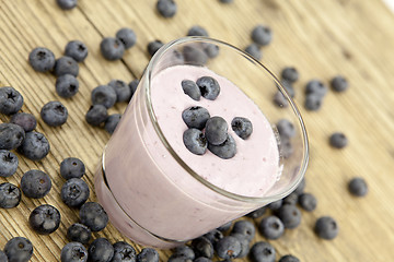 Image showing fresh delicious blueberry yoghurt shake dessert on table