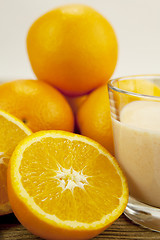 Image showing fresh tropical orange yoghurt shake dessert on table