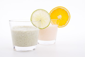 Image showing fresh tasty lime and orange yoghurt shake cream isolated