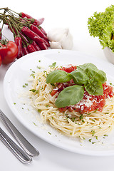 Image showing tatsty fresh spaghetti with tomato sauce and parmesan isolated