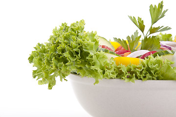 Image showing fresh tasty mixed salad with different vegetables isolated